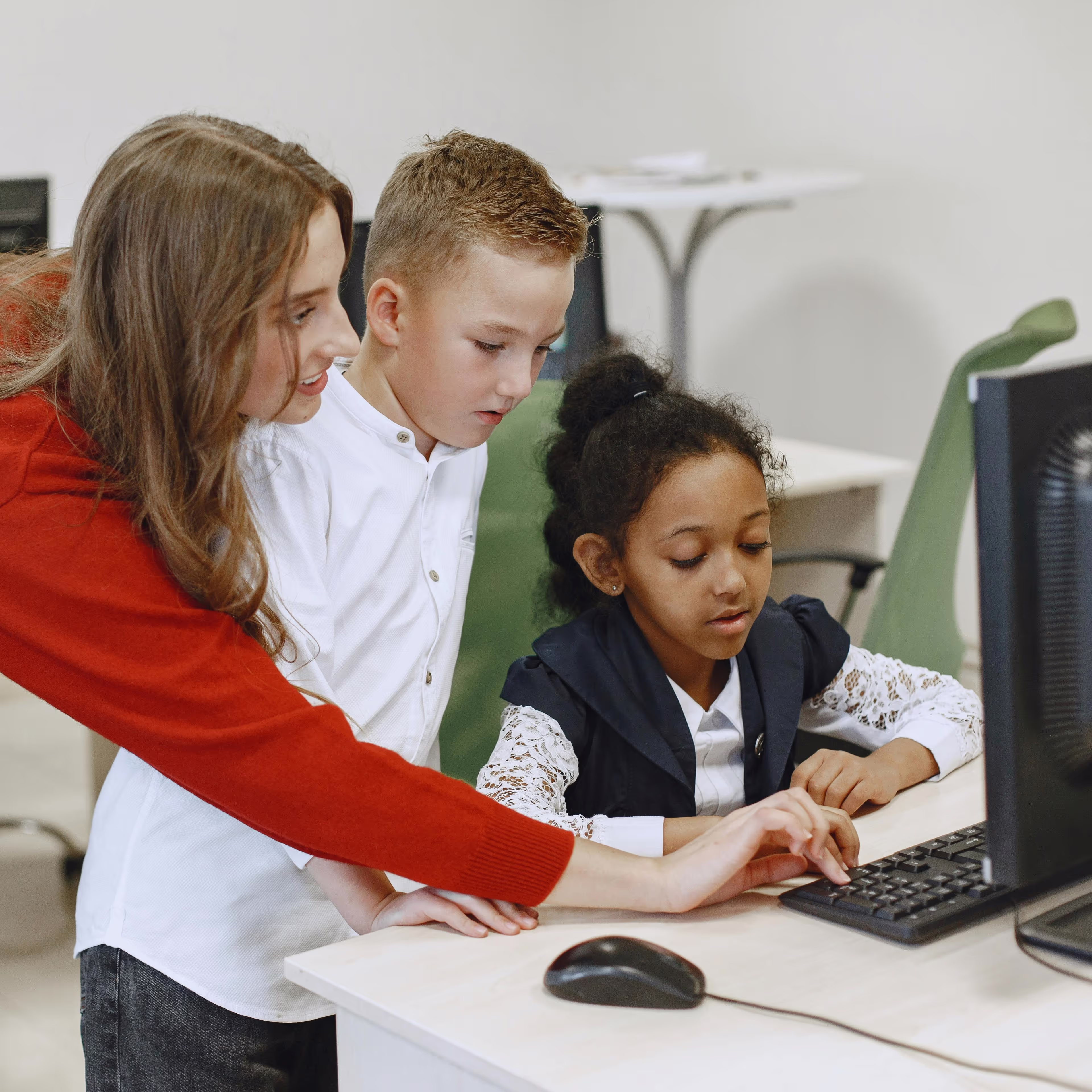 Teacher engaged with young readers in a classroom