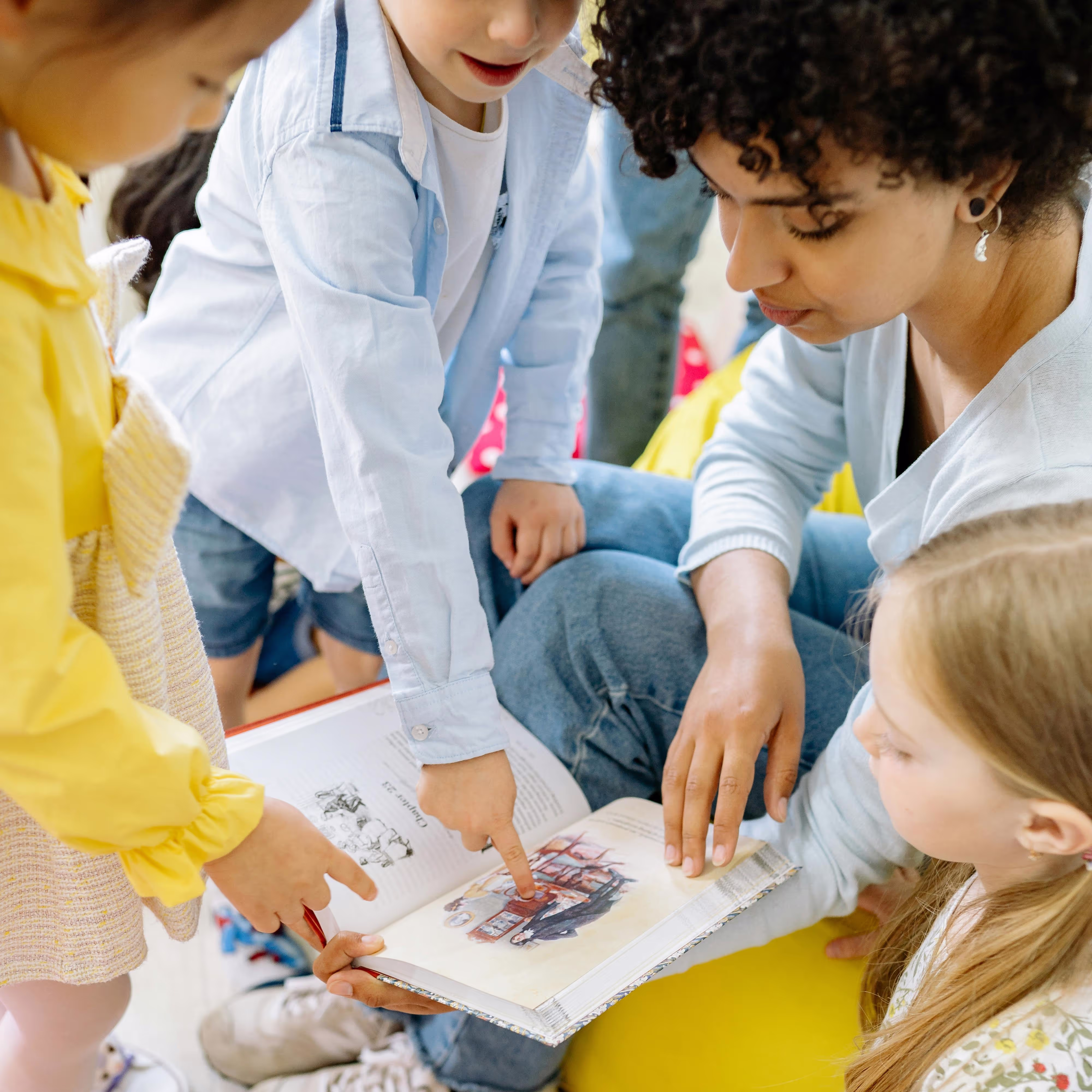 Teacher reading with children